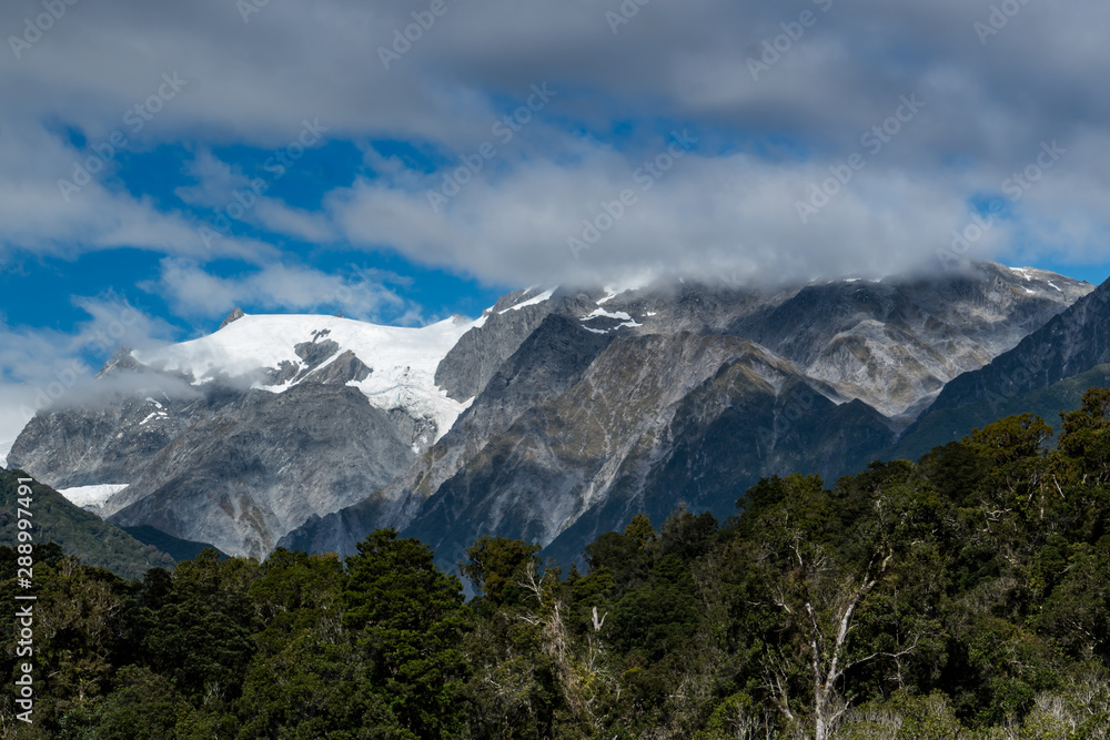 Snow capped Southern Alps scenery at Franz Josef West Coast New Zealand