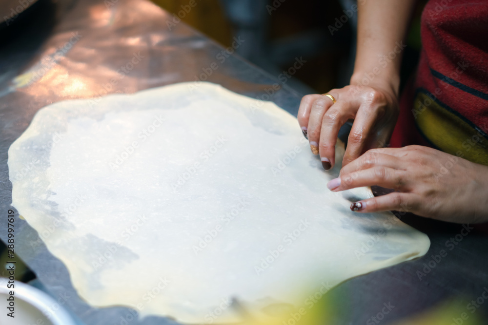 Roti Making, roti thresh flour by roti maker with oil.Thailand Street Food and Desserts. crispy pancake in Thailand