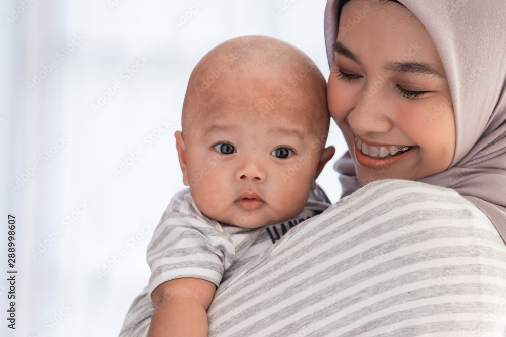 toddler with mother. young muslim woman with infant baby son toddler with mother. young muslim woman with infant baby son