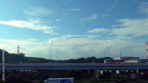 Japan Railway train window. Parallel with highway