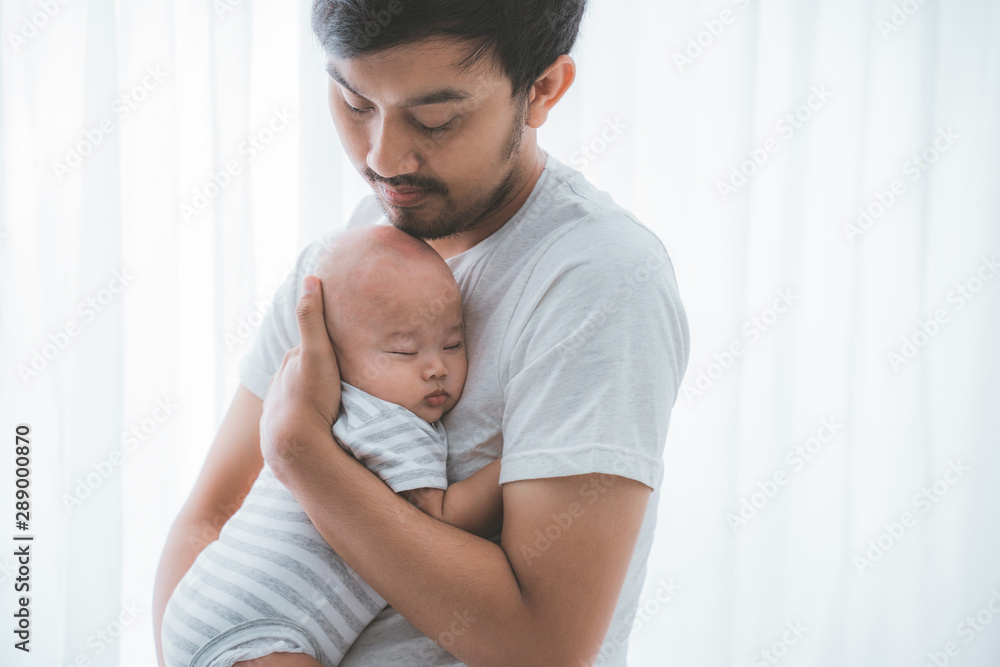 happy father carry his baby son playing together happy father carry his baby son playing together