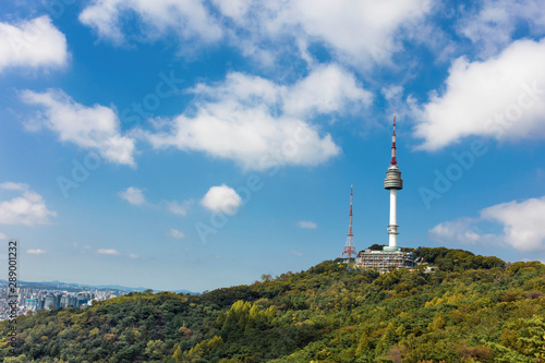 Seoul tower Located on Namsan Mountain with blue sky white clouds in Seoul, South Korea.