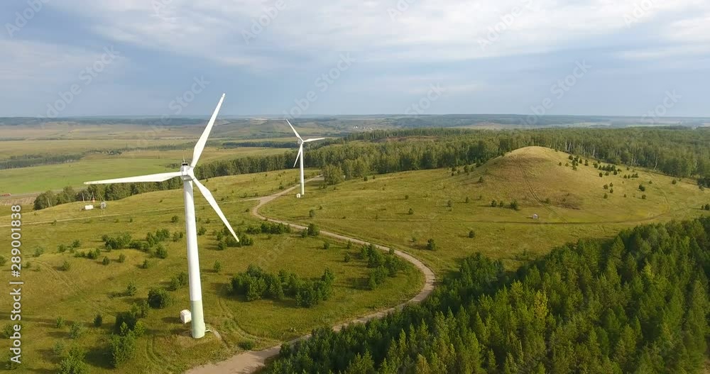 Copter view on Wind-driven generator in Russia. Electric power production. Green energy. Eco -friendly technology. Windmill or Wind power technology concept. 4k Copter view on Wind-driven generator in Russia. Electric power production. Green energy. Eco -friendly technology. Windmill or Wind power technology concept. 4k