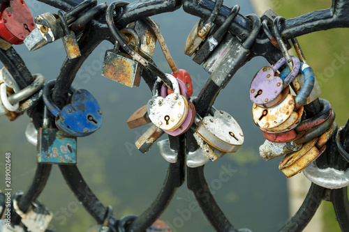 The wedding tradition of the bridge railing hung with locks with the names of lovers.