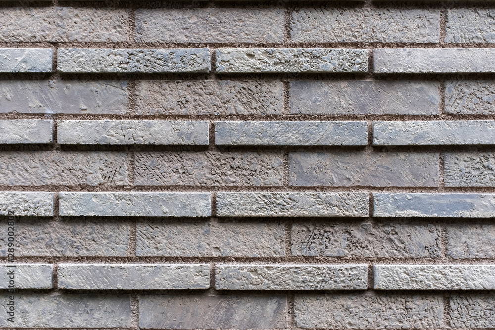 Closed up grey brick wall texture. Architectural material construction. Closed up grey brick wall texture. Architectural material construction.