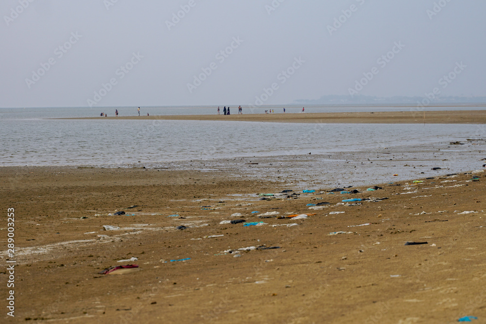 Lok Kawi, Kota Kinabalu, Sabah, Malaysia - September 08, 2019: There is a lot of rubbish left in Lok Kawi Beach. This rubbish are dumped into the sea and washed away to this beach. Lok Kawi, Kota Kinabalu, Sabah, Malaysia - September 08, 2019: There is a lot of rubbish left in Lok Kawi Beach. This rubbish are dumped into the sea and washed away to this beach.