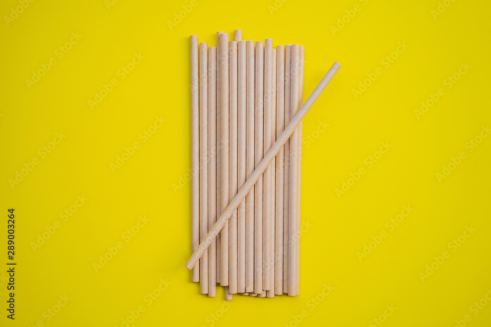 Retro paper straws on a yellow background Retro paper straws on a yellow background