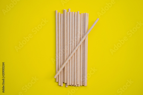 Retro paper straws on a yellow background