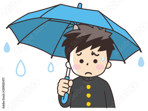 傘を差す憂鬱な中高生の男子