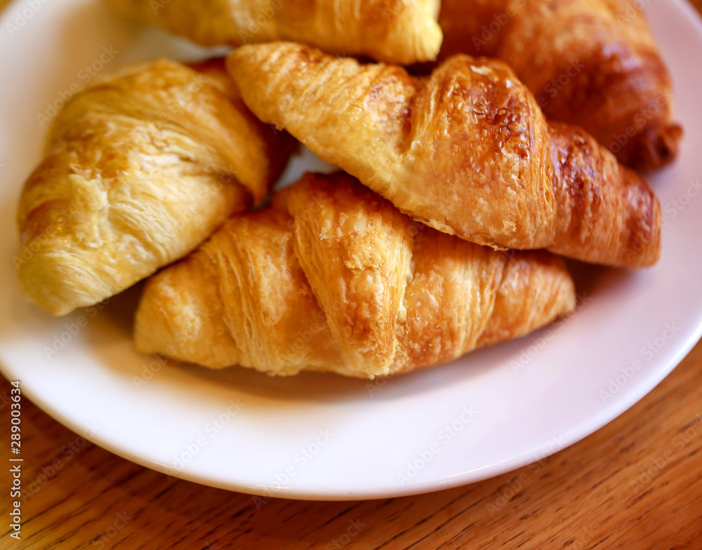 Delicious beautiful croissants on a plate