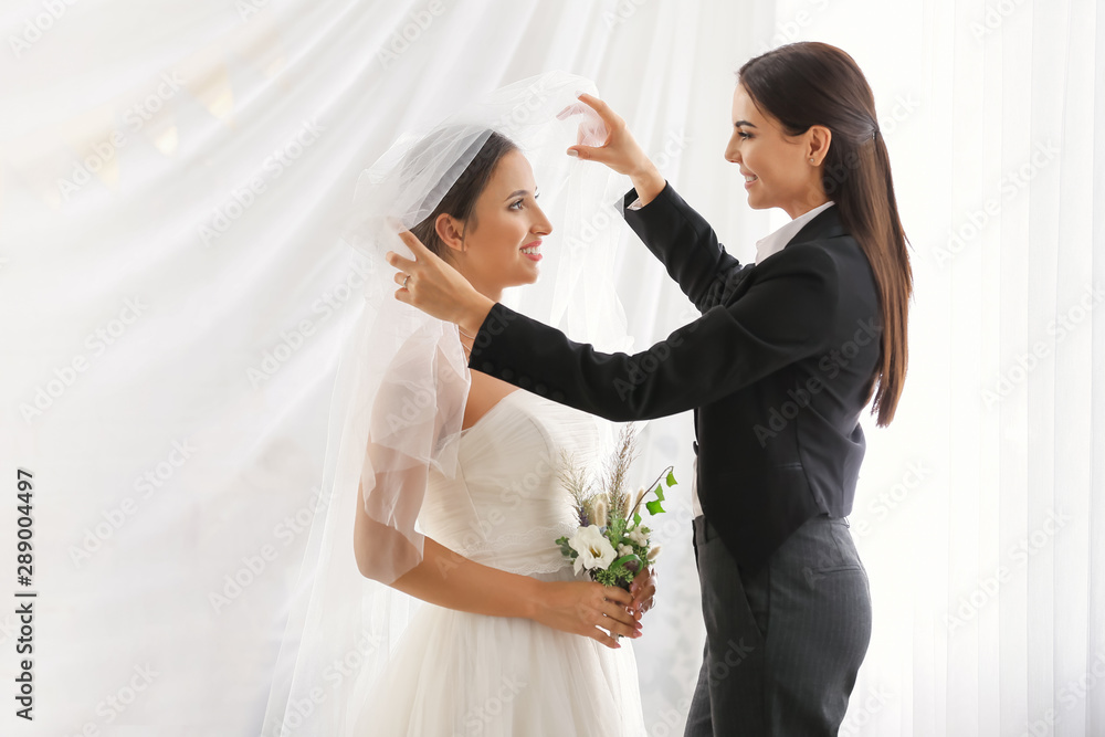 Beautiful lesbian couple during wedding ceremony Beautiful lesbian couple during wedding ceremony