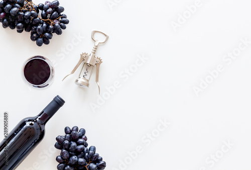 Open wine bottle. White background top view copy space