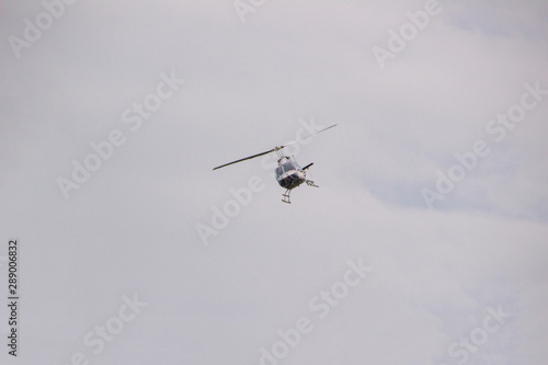 Flight of a helicopter with a cloudy gray background in Santa Catarina.