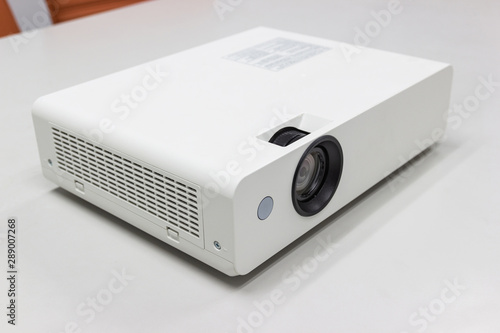 white projector for presentation for business work on table in a meeting room
