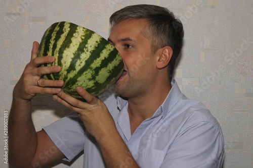 A man with a watermelon in his hands