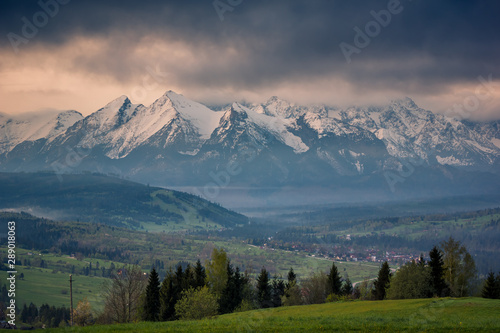 Panorama of snowy Tatra mountains during a foggy morning, Poland