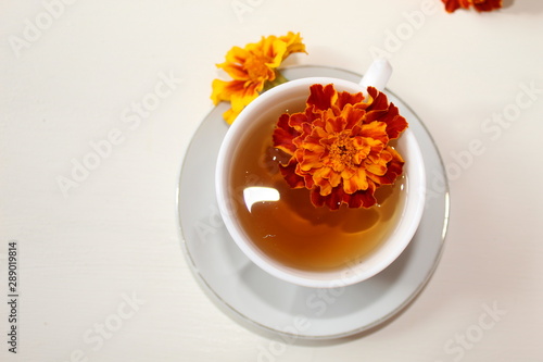 Delicious tea in a white Cup on a saucer.
