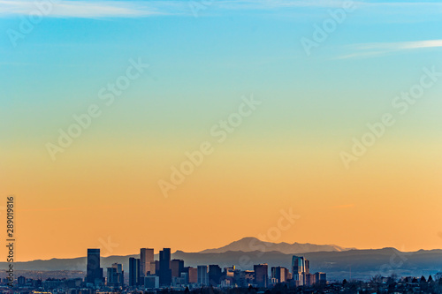 Denver skyline against a background of mountains