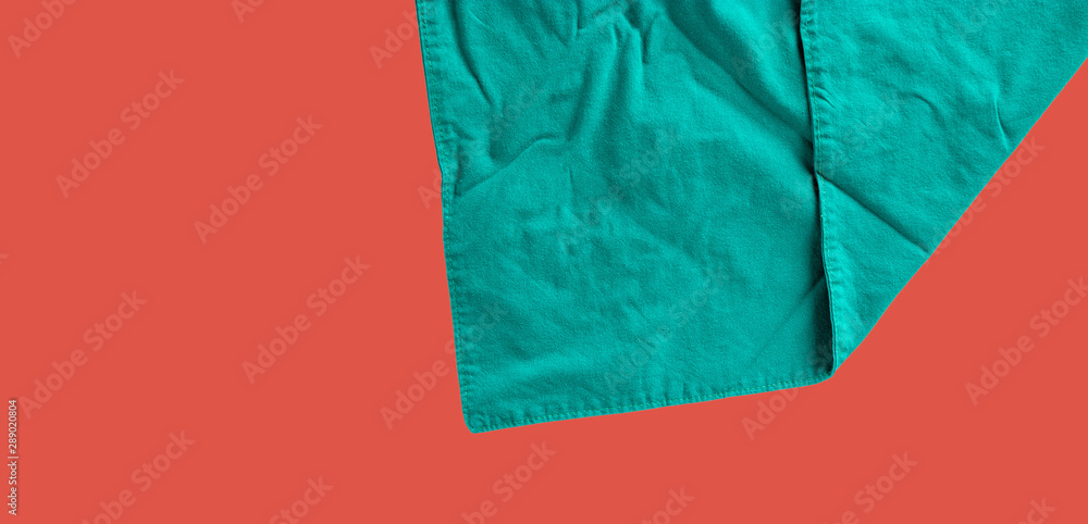 Green cloth in the operating room, medical concept, isolated on red.