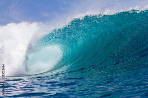 perfect turquoise wave breaking on a coral reef © Ryan