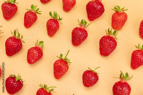 Strawberry flat lay on yellow background pattern