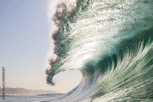 huge close up crashing wave on a beach, swimming