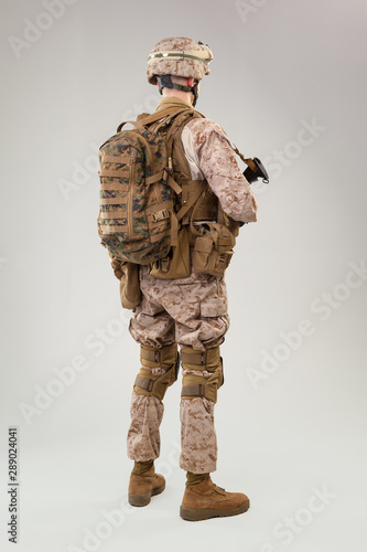 Rear view of military soldier US army marines operator studio shot portrait