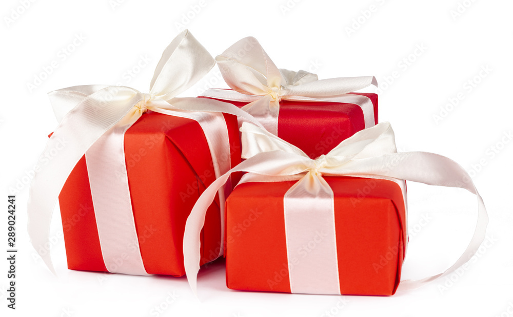 Stylish wrapped gifts with white ribbon isolated on white background Stylish wrapped gifts with white ribbon isolated on white background