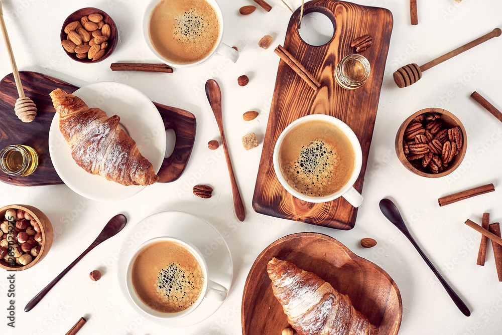 Fototapeta breakfast pattern, croissant, coffee, honey, cinnamon sticks, nuts, sugar. Good morning concept.