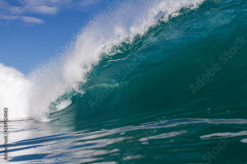 close up wave crashing on a shallow reef