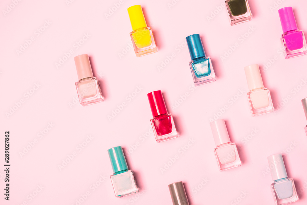 Colorful Nail polish bottles pattern background. Close up. Colorful Nail polish bottles pattern background. Close up.