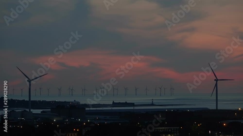 Sunset over Burbo Bank Offshore Windfarm Turbines in Liverpool Bay photo