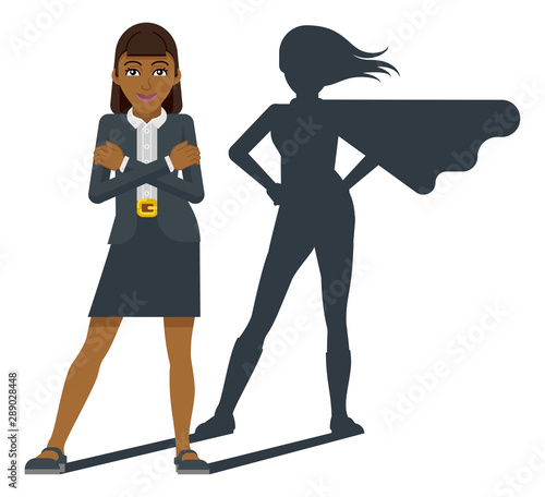 A young Asian business woman revealed as super hero by his superhero silhouette shadow