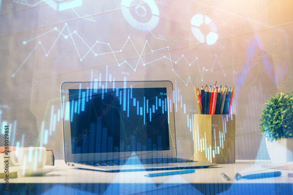 Forex market chart hologram and personal computer background. Multi exposure. Concept of investment. Forex market chart hologram and personal computer background. Multi exposure. Concept of investment.