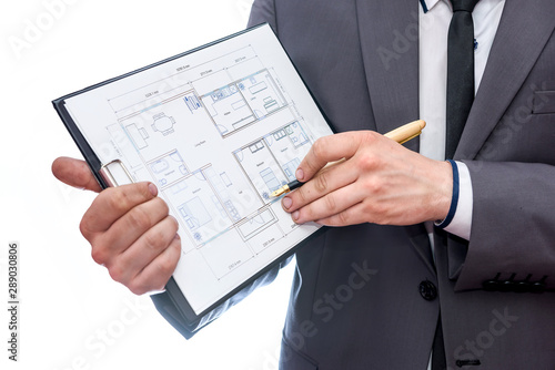 Hands with clipboard and house plan close up