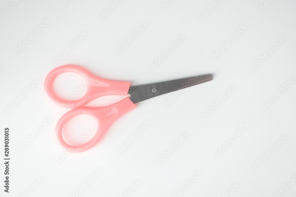 Small stainless steel scissors on white background, isolated object Small stainless steel scissors on white background, isolated object