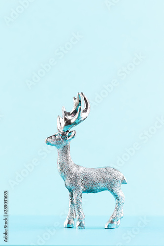 Christmas reindeer on pastel color background. Christmas or New Year minimal concept.