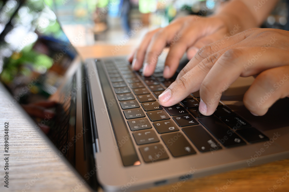 man using a computer to work Laptop, Desktop PC Human Hand on Office Stock Photo Adobe Stock