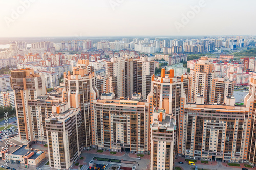 Huge residential area multi-storey high-rise buildings to the horizon  the evening sky aerial view.