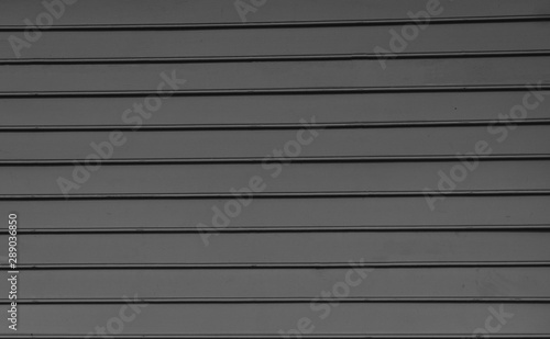 Pastel wood background texture with horizontal parallel boards color grey