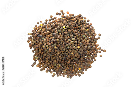 Macro flatlay image of brown lentils pile isolated at white background.