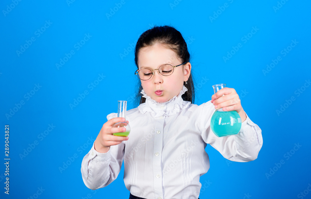 Basic knowledge. Knowledge day. Serious about studying. Schoolgirl with chemical liquids. Childhood and upbringing. Knowledge and information. Experimenting a bit. Small kid study. Education concept Basic knowledge. Knowledge day. Serious about studying. Schoolgirl with chemical liquids. Childhood and upbringing. Knowledge and information. Experimenting a bit. Small kid study. Education concept