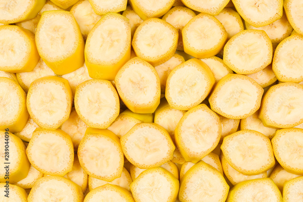 Fresh banana slices background. Top view. Fresh banana slices background. Top view.