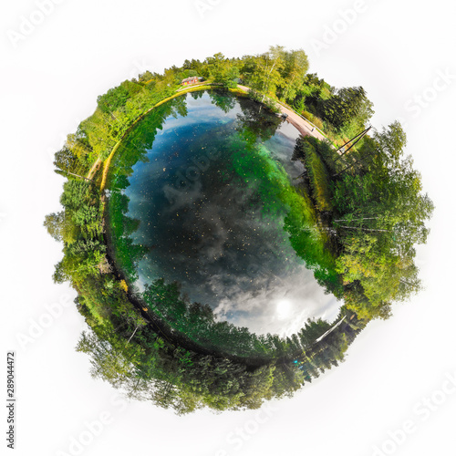 A three dimensional panoramic view of the turquoise spring Kiikunlahde in Hollola, Finland in a mini planet panorama style. photo
