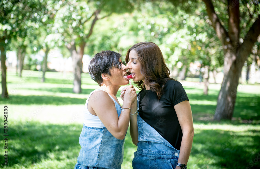 Lesbian women posing in the park Lesbian women posing in the park