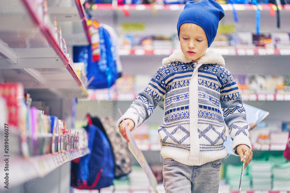 schoolboy in a stationery store schoolboy in a stationery store