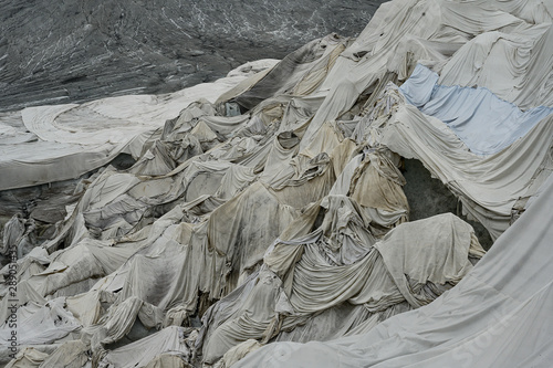 Schutztücher am Rhonegletscher gegen Eisschmelze, Wallis, Schweiz photo