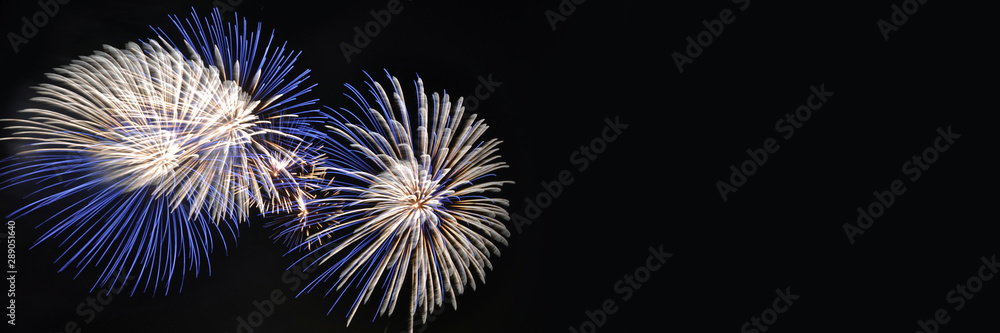 Naklejka premium Fireworks, panoramic background with copy space