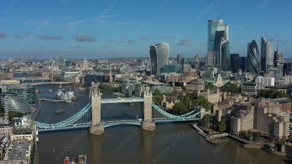 Aerial view of cityscape of London, Tower Bridge and Tower of London, skyscrapers skyline of City of London in background, clear blue sky - panorama of Great Britain from above, United Kingdom, Europe Aerial view of cityscape of London, Tower Bridge and Tower of London, skyscrapers skyline of City of London in background, clear blue sky - panorama of Great Britain from above, United Kingdom, Europe