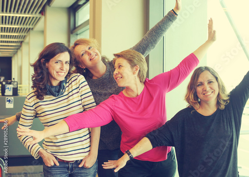 Portrait of four beautiful 40 years old woman traeling together photo